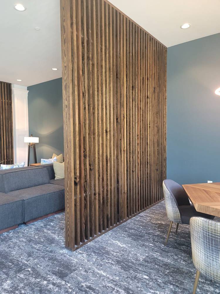 Commercial carpet with a custom wood slat feature wall